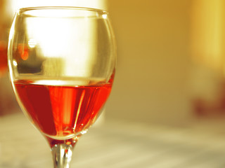 Glass of red wine on blurred background