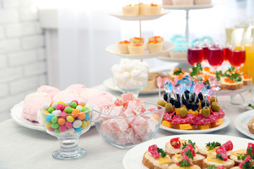 Set of cold snacks, canape, beverages and dessert, closeup