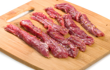 Raw meat on a white background