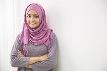 Young asian muslim woman in head scarf smile