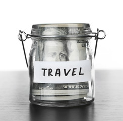 Jar for savings full of banknotes