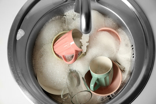 Kitchen Sink Full Of Dishes Closeup