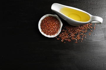 Flax seeds with oil on wooden table