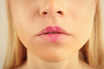 Fototapeta premium Sexy lips with lilac heart shape paint, closeup