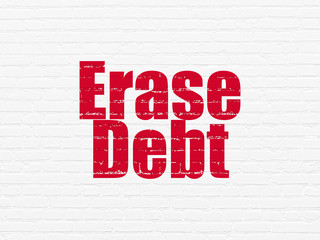 Business concept: Erase Debt on wall background