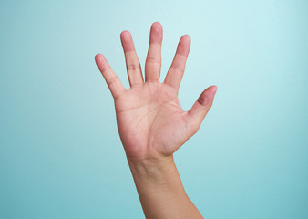 man's hand isolated on blue background