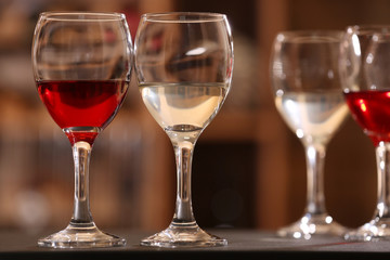 Glasses of red and white wine closeup