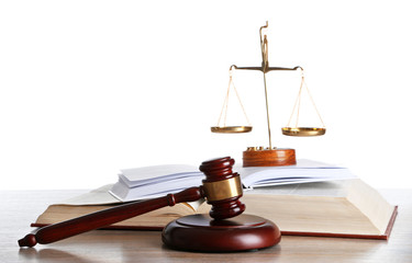 Wooden gavel with justice scales and open books on white background