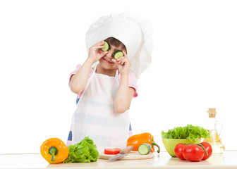 Funny cook child girl cooking at kitchen