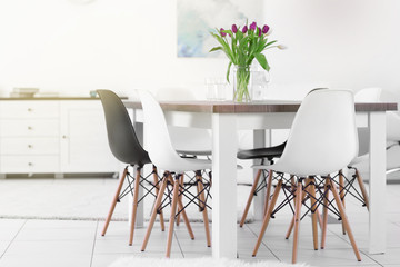 Modern living room with table and chairs