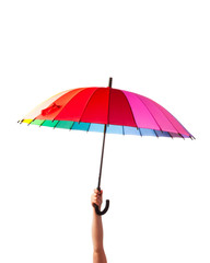 Obraz premium hand holding multicolored umbrella, isolated on white