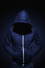 Fototapeta na wymiar Low key image of a man in hoodie shirt 