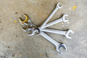 Mechanic tools on scratched background