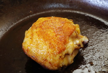 freshly fried chicken on pan closeup