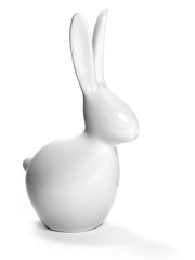 Easter decoration. Porcelain rabbit, isolated on white background. Selective focus of a china easter bunny. 