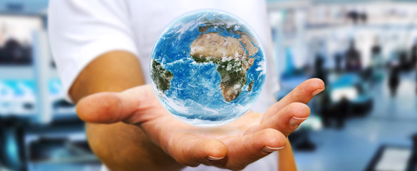 Man holding the planet earth in his hand