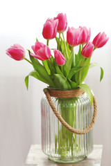 Bouquet of pink tulips in a vase, close up