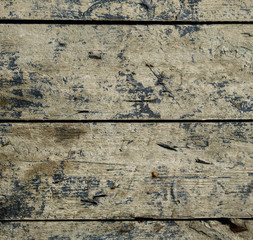 Weathered old wooden board with residual traces of paint