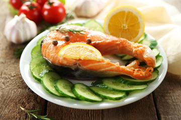 Fish with vegetables on plate