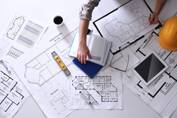Architect working with blueprints