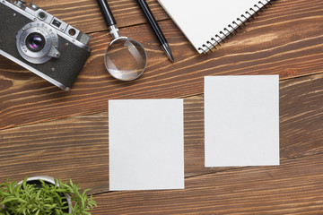 Travel, vacation concept. Camera, notepad, pen, credit card, supplies and photography on office...