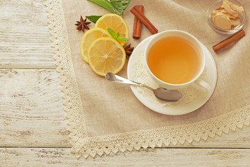 Obraz na płótnie Canvas Cup of tea with ginger on napkin