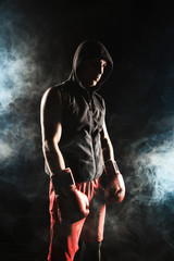 Fototapeta na wymiar The young man kickboxing 