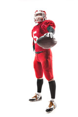 American football player posing with ball on white background
