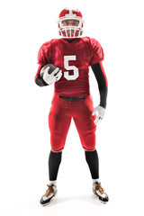 American football player posing with ball on white background © master1305