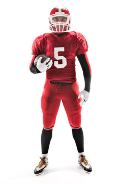 American Football Player Posing With Ball On White Background