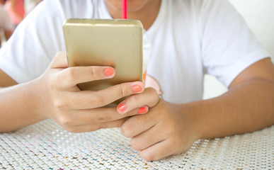 close up hand of girl using smart phone