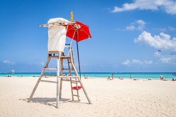 lifeguard tower protecting the safety of tourist on the beach at Playa del Carmen, Mexico