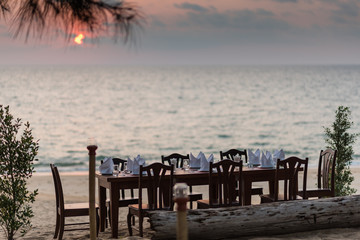 Dinner table set on the beach