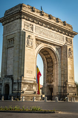 Fototapeta na wymiar Arcul de Triumf ( Arch of Triumph ) is a triumphal arch located in the northern part of Bucharest, on the Kiseleff Road. Was build for the Heroes of the War of Independence and World War I.