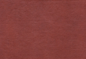 Artificial brown leather surface.