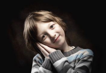 Boy Leaning his Head on his Hands