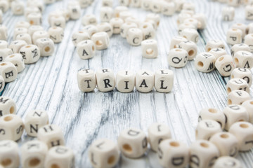 TRIAL word written on wood block. Wooden ABC