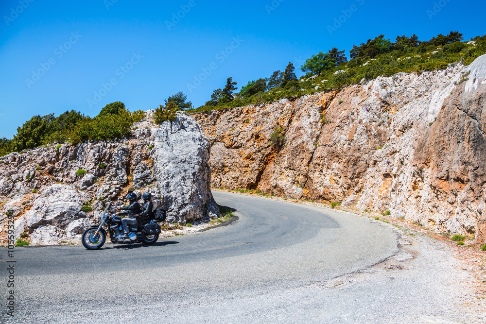 Wall mural Motorcycle with two motorcyclists on a mountain road