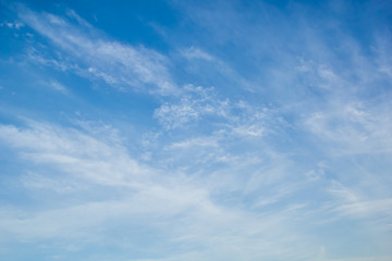 Blue sky with light white cirrus clouds