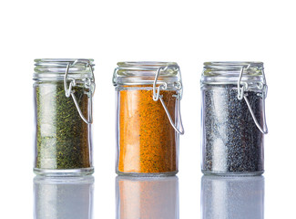 Parsley, Curry Powder and Poppy Seeds on White Background