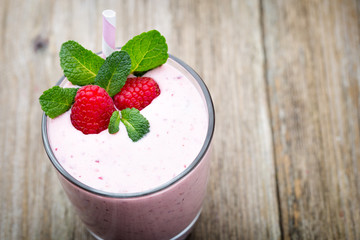 Raspberry milk shake with mint decor.