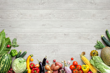 Healthy eating background. Studio photo of different fruits and vegetables on white wooden table. High resolution product.