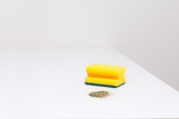 scattered debris and a sponge for cleaning