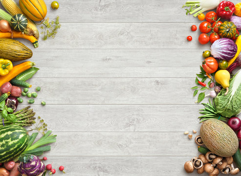 Healthy eating background. Studio photo of different fruits and vegetables on white wooden table. High resolution product.