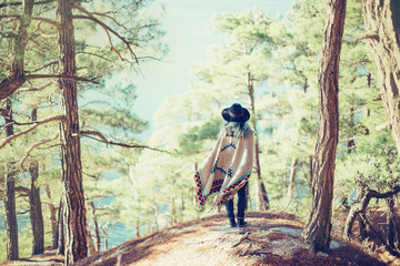 Woman walking in summer forest