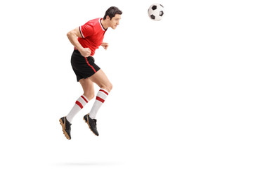 Male football player heading a ball