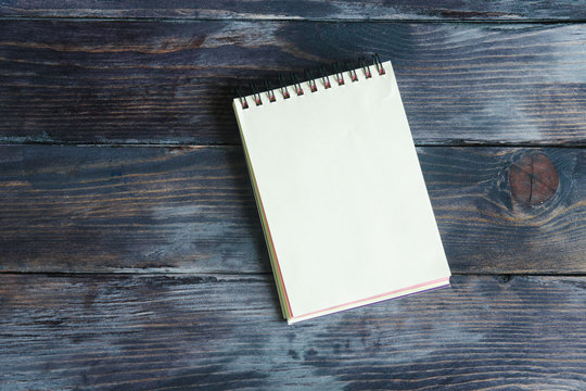 notebook on a wooden background