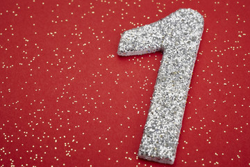 Number one silver color over a red background. Anniversary