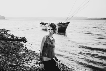 beautiful unusual woman posing in sea scenery 