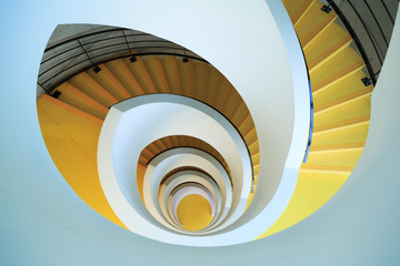 LYON, FRNACE - FEBRUARY 17, 2016: A unique yellow spiral staircase at Bibliothèque Universitaire...